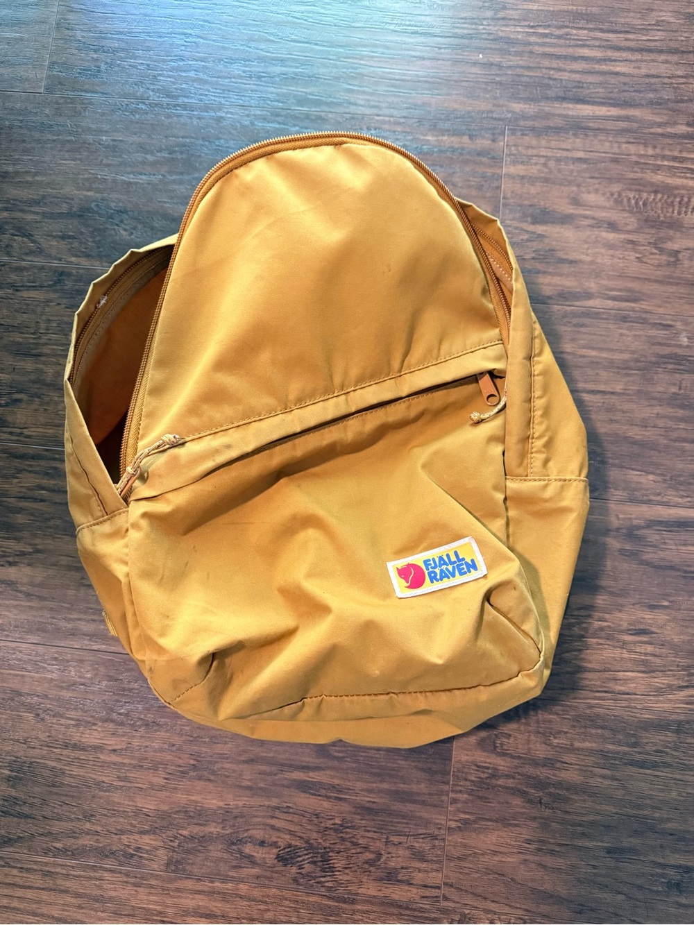 Fjallraven Kanken Backpack in Mustard Yellow with Gray Interior